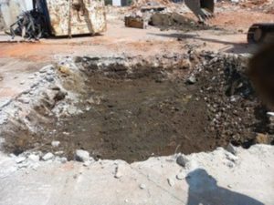 Excavated ground at demolition site